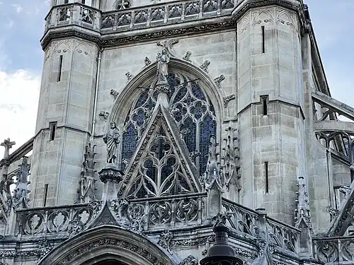 The upper facade arch , with Virgin and Child at the top