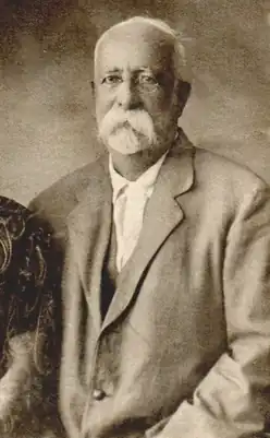 Sepia photograph of an elderly man, with whiskers