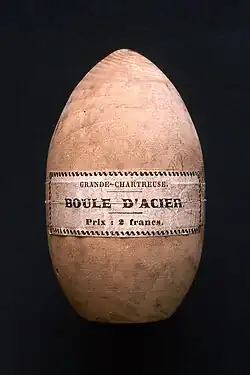 Wooden case of ovoid shape, on which is written: "Grande chartreuse - Boule d'acier".