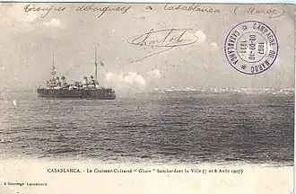 A postcard showing the French cruiser Gloire recoiling from firing artillery at the city during the bombardment of Casablanca August 1907.