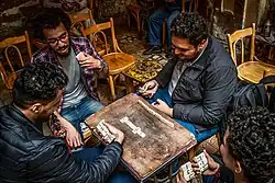 A group of Egyptians playing domino