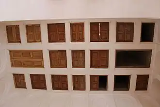 A windtower from below, inside, showing that it is partly closed off