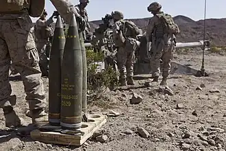 M795 artillery shells with fuzes fitted, labelled to indicate a filling of TNT