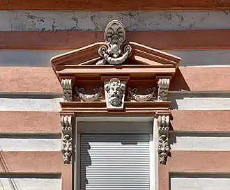 Beaux Arts acroterion above a window of Strada Grigore Cobălcescu no. 14, Bucharest, unknown architect or sculptor, c.1900