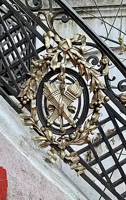 Neo-Louis XVI style medallion on a stair railing of the Nicolae T. Filitti/Nae Filitis House (Calea Dorobanților no. 18), Bucharest, by Ernest Doneaud, c.1910[17]