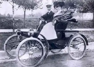 George Dorris and his wife in a 1901 St. Louis runabout
