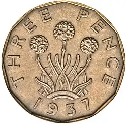 Brass coin depicting a plant