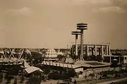 The New York State Pavilion during the 1965 season of the World's Fair. The Tent of Tomorrow and observation towers can be seen at right. Several other pavilions are visible to the left.