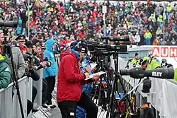 Biathlon coaches use spotting scopes to verify and optimize competitors shot placement