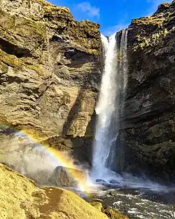 Kvernufoss waterfall with rainbow