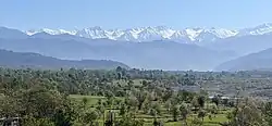 A panoramic vista capturing the majestic Pir Panjal mountain range (Lower Himalayas) as seen from Tatrinote, AJK.