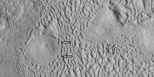 Brain terrain being formed, as seen by HiRISE under HiWish program Note: this is an enlargement of the previous image using HiView. Arrows indicate spots where brain terrain is beginning to form.