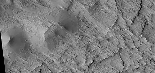Close view of contact between ridge network and overlying layer, as seen by HiRISE under HiWish program