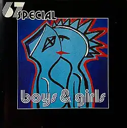 Artist's name is printed at top left in two different styles, above the central image. The album name is across the bottom covering the lower portion of the central image. That image is a cartoon-like depiction of a couple kissing shown in side profile, they are coloured in blue with black outlines and red accentuation.