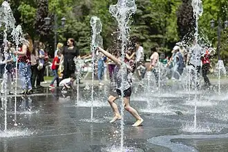 Engraved square in the shape of Yerevan's map, featuring 45 upward water jets
