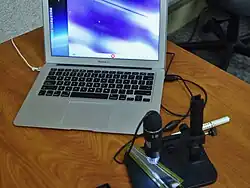 A Forward Silicon Vertex Detector (FVTX) sensor of PHENIX detector on a microscope[19]