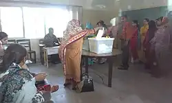 A voter casts their vote in the 2013 general elections