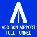 A blue sign with a stylized "A" logo and the name of the tunnel.