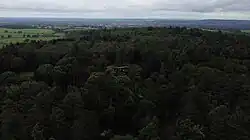 Aerial view of Youlbury House's surrounded by dense woodland.