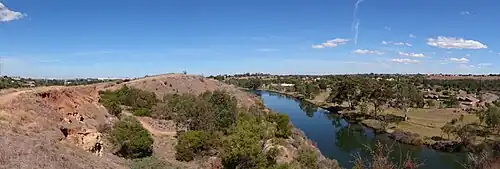 The reserve showing remains of caves (left) and the defunct Defence Explosive Factory Maribyrnong across the river