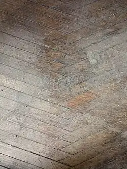 A unique design in the hardwood flooring from a roller skating rink built in 1885 forms a sawtooth pattern where edges meet.