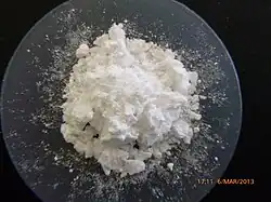 Heap of white powder on a watch glass