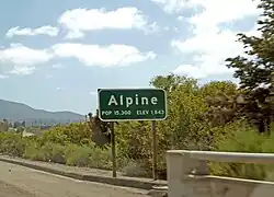 Alpine's town sign at its western border, as seen from I-8