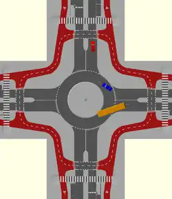 A single lane roundabout with a bidirectional circulatory cycle track and set back cycle crossings. Cyclists must give way to vehicles leaving and joining the roundabout.
