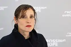 Papoulia touching her face