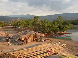 Aquaculture, salt and fishponds in the bay, and an extensive mature mangrove patch, in 2006