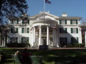 Three-story house with semicircular portico