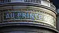 One of the Printemps Haussmann's frontage mosaics, reading 'Au Printemps' ('At the Printemps')