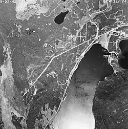 A top-down, black-and-white photograph of Shadow Mountain Lake.