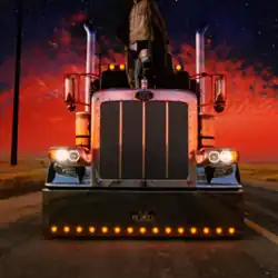 Bad Bunny standing on the hood of a big rig truck with a sunset in the background