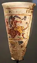 Goblet showing The Rape of Europa and of Ganymede, part of the Bagram Treasure; 1st century AD; painted glass; height: 16 cm, diameter: 10 cm; Guimet Museum (Paris)[84]
