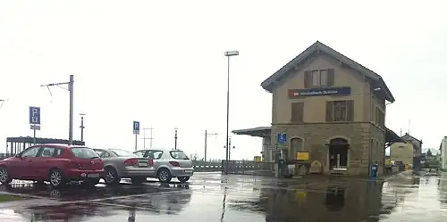 Three-story building with gabled roof