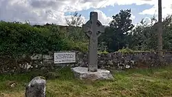 A plaque and high cross near the main quarry entrance
