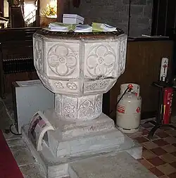 The 14th-century baptismal font