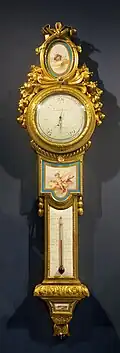 Louis XVI style barometer-thermometer; c. 1776; soft-paste Sèvres porcelain, enamel, and ormolu; height: 1 m, width: 0.27 m[106]