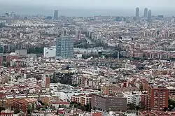 Verdum (in the foreground) as seen from the Carretera Alta de Roquetes