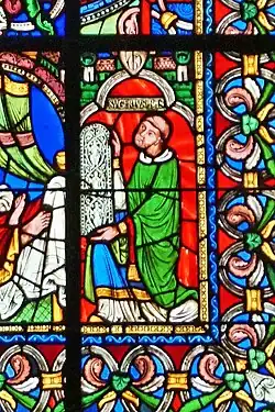 Detail of Suger kneeling in the lower right corner of Tree of Jesse window