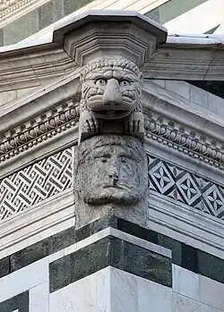 Male face on scarsella