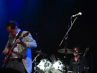 Alex Chilton and Jody Stephens of Big Star perform on stage.