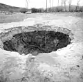 Crater caused by an artesian fountain