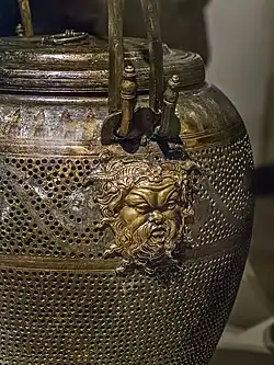 Closeup of Pan relief on bronze lantern