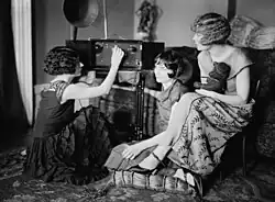 Image 31Around 1920, radio broadcasting started to get popular. The Brox Sisters, a popular singing group, gathered around the radio at the time. (from History of radio)