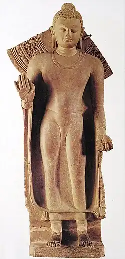 Buddha, standing, inscribed: "Gift of Abhayamira in 154 GE" 474 CE in the reign of Kumaragupta II. Sarnath Museum.[8]
