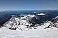 From Steamboat Prow looking down at snow-covered Burroughs Mountain (third, second, and first left to right) and Sunrise (farther right)