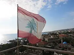 Lebanese flag flying over Byblos Castle, overlooking the city