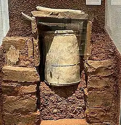 lead cylinder in rectangular stone grave